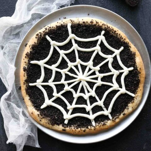 This Cobweb Oreo Dessert Pizza is an easy and fun Halloween party food that will be enjoyed by guests of all ages.