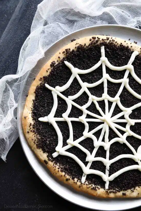 This Cobweb Oreo Dessert Pizza is an easy and fun Halloween party food that will be enjoyed by guests of all ages.