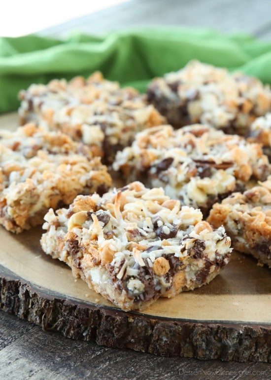 Seven Layer Bars, magic cookie bars, kitchen sink bars, whatever you call them, this classic dessert is easy and delicious. A graham cracker crust, chocolate, white chocolate, and butterscotch chips, nuts, and shredded coconut are melded together with sweetened condensed milk.