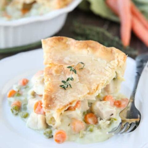 This classic Chicken Pot Pie is made from scratch with a creamy and flavorful chicken and vegetable filling tucked inside of a flaky pastry crust. Homemade comfort food that the whole family loves!