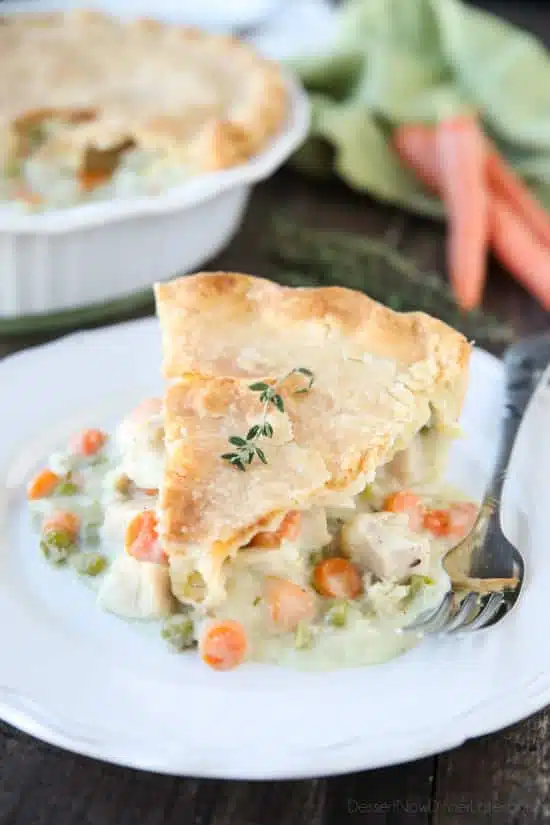 This classic Chicken Pot Pie is made from scratch with a creamy and flavorful chicken and vegetable filling tucked inside of a flaky pastry crust. Homemade comfort food that the whole family loves!