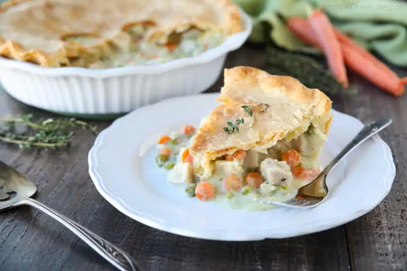 This classic Chicken Pot Pie is made from scratch with a creamy and flavorful chicken and vegetable filling tucked inside of a flaky pastry crust. Homemade comfort food that the whole family loves!