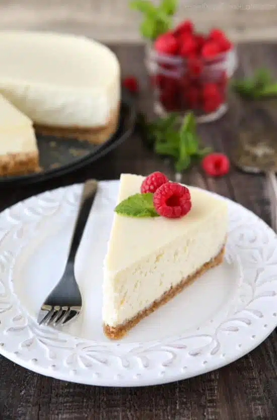 This Classic Cheesecake recipe is smooth, creamy, moist, and full of vanilla, with a graham cracker crust. Plus all the tips and tricks for the perfect cheesecake with no cracks! A great dessert for the holidays or any occasion.