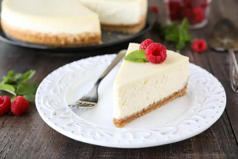 This Classic Cheesecake recipe is smooth, creamy, moist, and full of vanilla, with a graham cracker crust. Plus all the tips and tricks for the perfect cheesecake with no cracks! A great dessert for the holidays or any occasion.