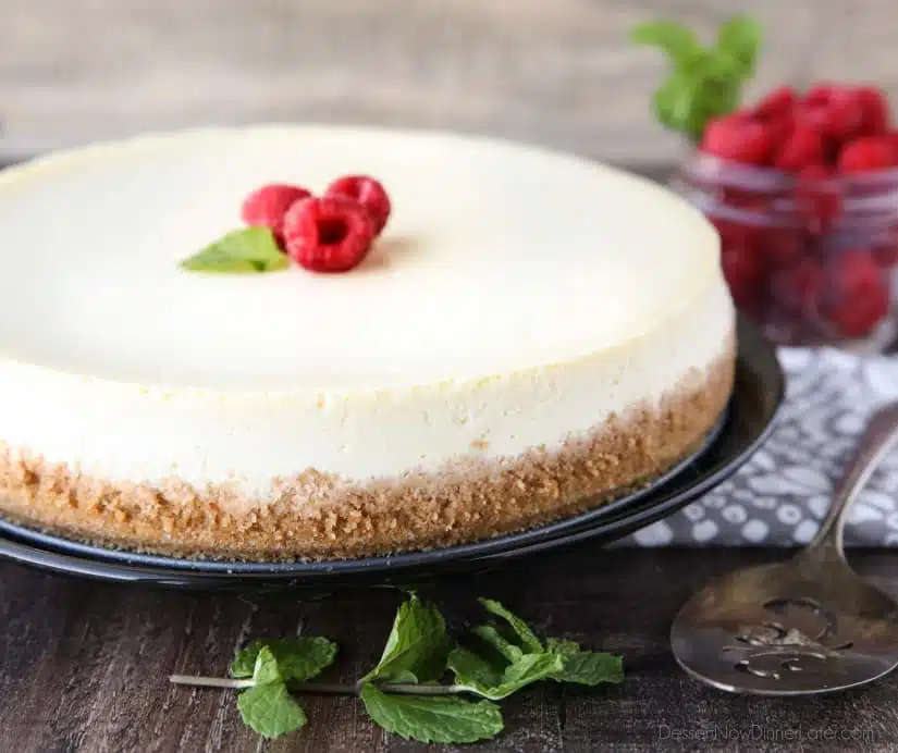 This Classic Cheesecake recipe is smooth, creamy, moist, and full of vanilla, with a graham cracker crust. Plus all the tips and tricks for the perfect cheesecake with no cracks! A great dessert for the holidays or any occasion.