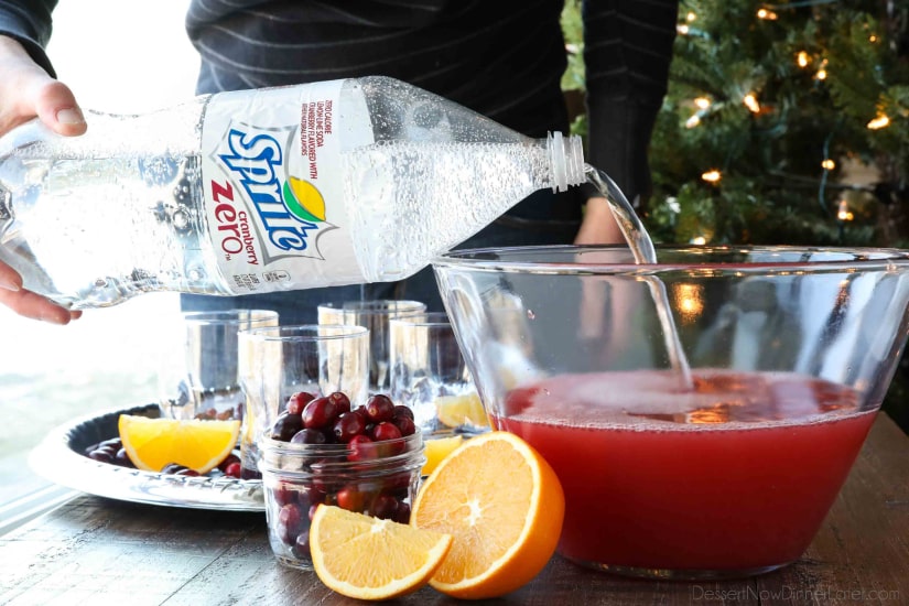 This non-alcoholic Cranberry Orange Mocktail is an easy and refreshing fruit punch drink for the holidays. It's fizzy, fruity, and only 3 ingredients!