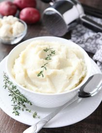 Lightened-up Creamy Cauliflower and Mashed Potatoes is a healthier side dish, with half cauliflower and half potatoes. Velvety smooth and creamy with less carbs and no milk, sour cream, or butter. Delicious enough for Thanksgiving or Christmas, yet simple enough for any dinner.