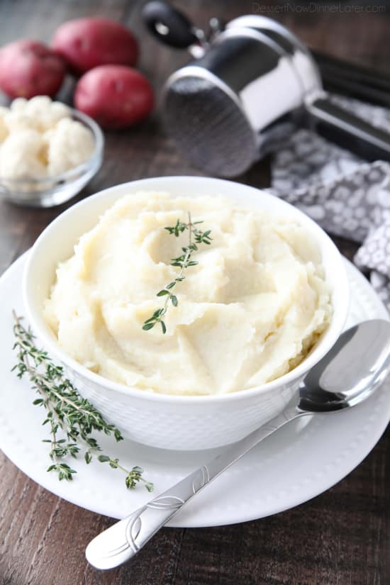 Lightened-up Creamy Cauliflower and Mashed Potatoes is a healthier side dish, with half cauliflower and half potatoes. Velvety smooth and creamy with less carbs and no milk, sour cream, or butter. Delicious enough for Thanksgiving or Christmas, yet simple enough for any dinner.