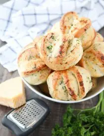 These easy Garlic Parmesan Rolls have layers of flavor to pull apart and savor in every bite. The perfect dinner rolls for holidays or any meal. You'll love these shortcut butterflake rolls. 