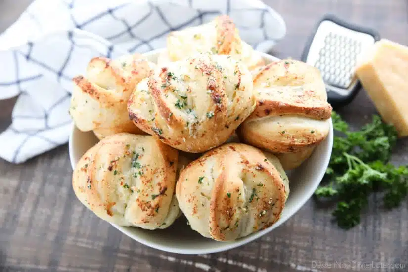 These easy Garlic Parmesan Rolls have layers of flavor to pull apart and savor in every bite. The perfect dinner rolls for holidays or any meal. You'll love these shortcut butterflake rolls. 