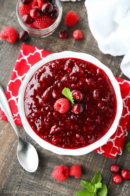 This easy raspberry cranberry sauce is sweet, tangy, and quick (only 4 ingredients & 15 minutes) to make! Uses fresh or frozen fruit, and is easy to make ahead of time. A classic for Thanksgiving or Christmas dinner.