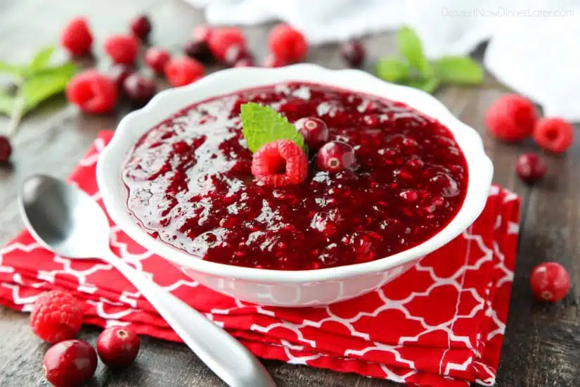 This easy raspberry cranberry sauce is sweet, tangy, and quick (only 4 ingredients & 15 minutes) to make! Uses fresh or frozen fruit, and is easy to make ahead of time. A classic for Thanksgiving or Christmas dinner.