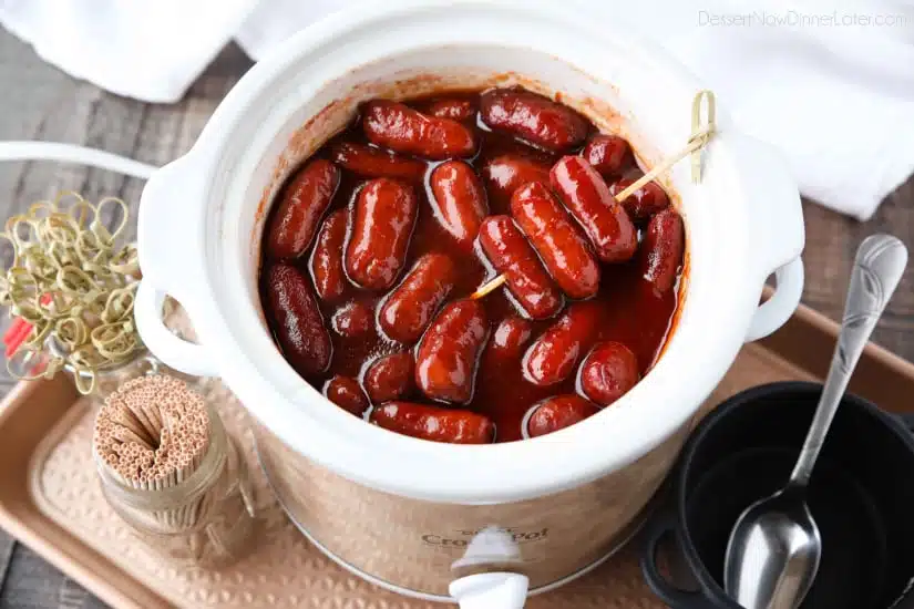 Crockpot Little Smokies is an easy appetizer for parties, the big game, or holidays. Only three ingredients and a slow cooker is all you need for these cocktail sausages. The sweet and tangy sauce is great on meatballs too! 