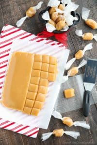 This Homemade Caramels recipe is so soft, chewy, and melt-in-your mouth buttery. A delicious candy that is the perfect holiday gift for Christmas neighbor plates.