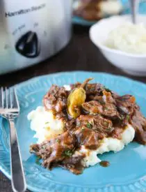 This flavorful Mississippi Pot Roast is a great make-ahead freezer meal. It's slow cooked in the crock pot to create tender shredded beef in a saucy gravy. Serve it with mashed potatoes, rice, or noodles.