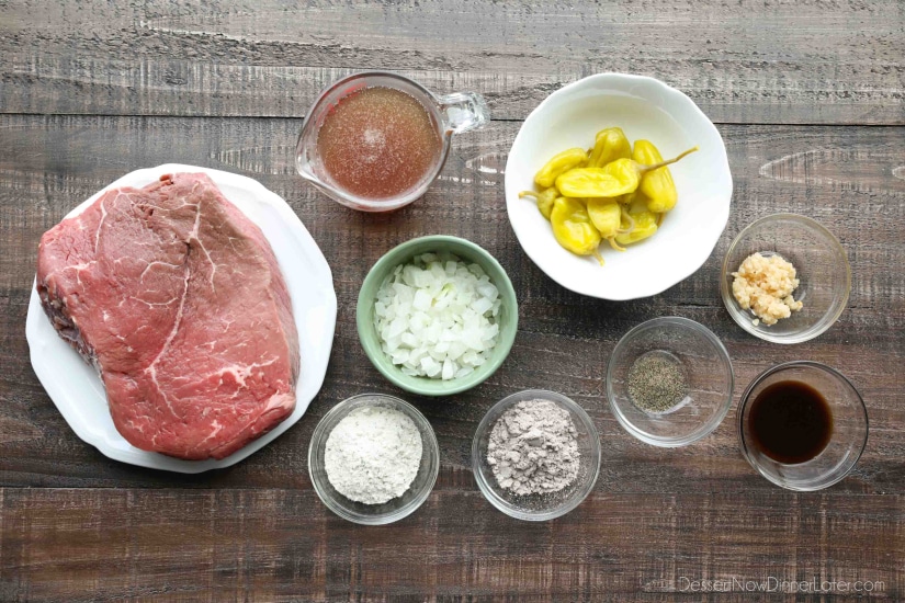 Ingredients for Mississippi Pot Roast: beef roast, ranch mix, au jus mix, pepperoncini peppers, beef broth, onions, garlic, Worcestershire sauce, and ground black pepper.