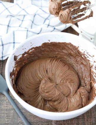 This is the BEST Chocolate Cream Cheese Frosting! Silky smooth and creamy, yet thick and sturdy enough for piping on cakes or cupcakes. It’s super easy to make and not too sweet.