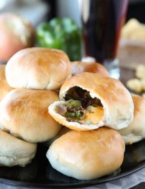 Philly Cheesesteak Bombs are easy to make with pre-made dough that's stuffed with meat, veggies, and two kinds of cheese! A tasty game day appetizer, or hot pocket sandwich for dinner!