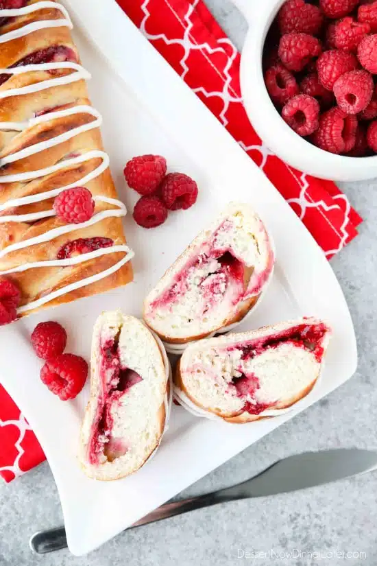 Raspberry Breakfast Braid - a quick raspberry sauce and cream cheese filling are stuffed inside this easy braided bread that's drizzled with a sweet and simple icing. A special breakfast or dessert for weekends or holidays with step-by-step pictures to help you make it.