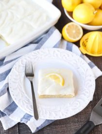 These Blonde Lemon Brownies are wonderfully tangy, sweet, and moist dessert bars. They have a dense texture like a fudgy brownie, and are topped with a creamy lemon icing for the ultimate lemon dessert.