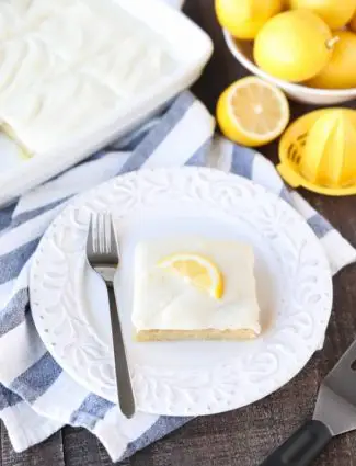These Blonde Lemon Brownies are wonderfully tangy, sweet, and moist dessert bars. They have a dense texture like a fudgy brownie, and are topped with a creamy lemon icing for the ultimate lemon dessert.