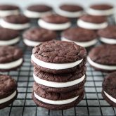 These easy Homemade Oreos are made completely from scratch. Soft, fudgy chocolate cookies are stuffed with a simple, vanilla cream filling. (Cream Cheese Frosting recipe also available for filling.)