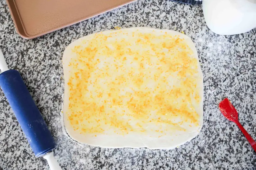 Orange Rolls - Spread orange zest sugar over butter layer.