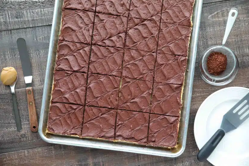 These Peanut Butter Bars with oatmeal are a soft and chewy baked cookie dessert topped with an extra layer of peanut butter, and a decadent chocolate frosting. Perfect for parties and potlucks! (Serves a crowd.)