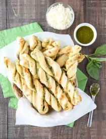 These easy Pesto Breadsticks are soft and flavorful with savory basil pesto and cheesy mozzarella twisted inside. A great appetizer or side for soup, salad, or pasta.﻿