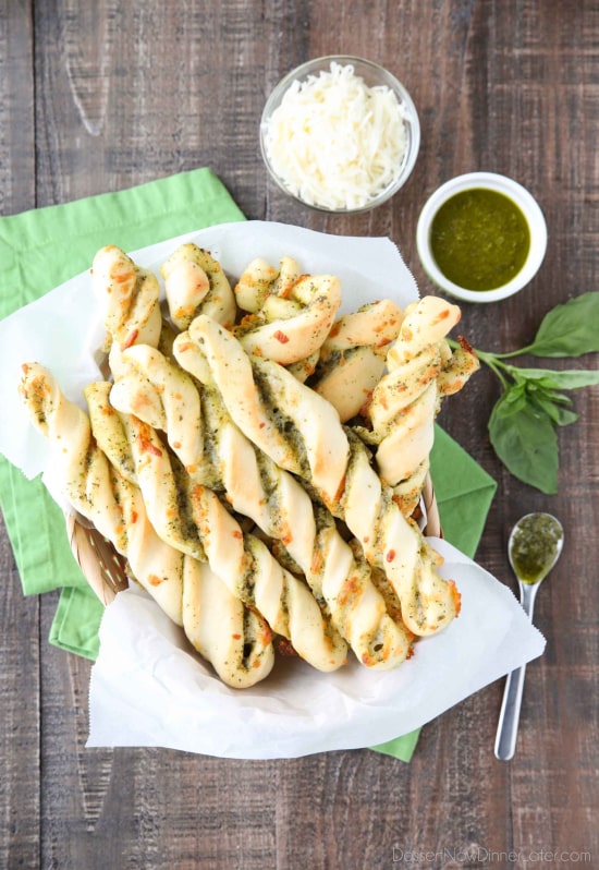 These easy Pesto Breadsticks are soft and flavorful with savory basil pesto and cheesy mozzarella twisted inside. A great appetizer or side for soup, salad, or pasta.﻿