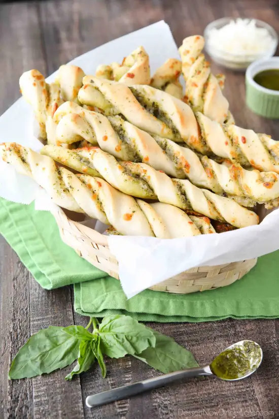 These easy Pesto Breadsticks are soft and flavorful with savory basil pesto and cheesy mozzarella twisted inside. A great appetizer or side for soup, salad, or pasta.