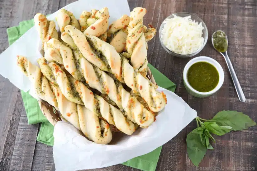 These easy Pesto Breadsticks are soft and flavorful with savory basil pesto and cheesy mozzarella twisted inside. A great appetizer or side for soup, salad, or pasta.