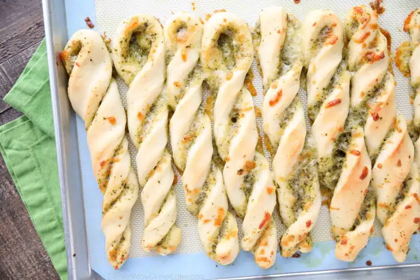 These easy Pesto Breadsticks are soft and flavorful with savory basil pesto and cheesy mozzarella twisted inside. A great appetizer or side for soup, salad, or pasta.