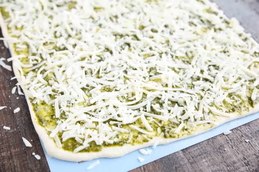 Rhodes bread dough slathered with pesto and shredded mozzarella.