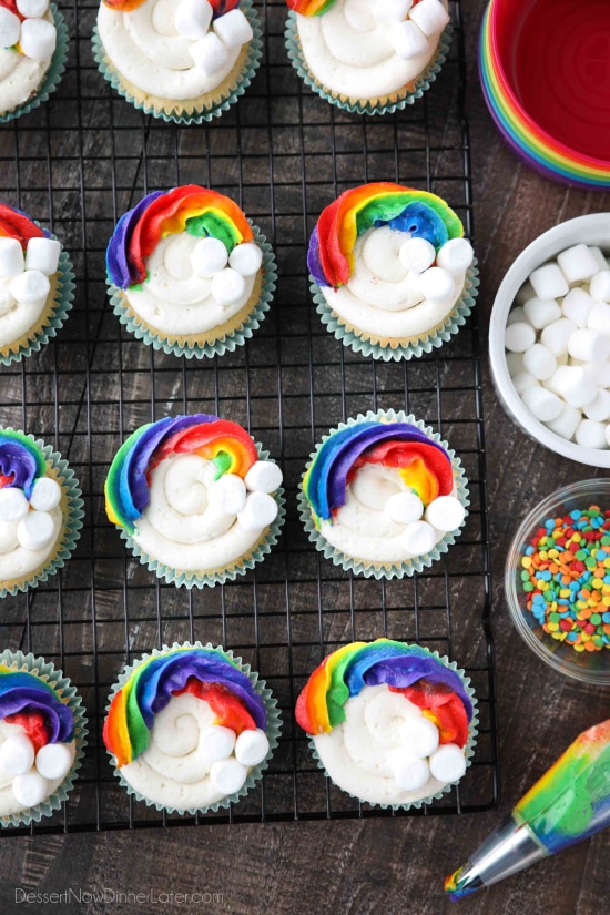 These Funfetti Rainbow Cupcakes are colorful inside and out! Homemade funfetti cupcakes are moist and full of sprinkles. Then topped with a colorful buttercream rainbow and mini marshmallow clouds. Super fun for birthday cupcakes or perfectly festive for St. Patrick's Day!