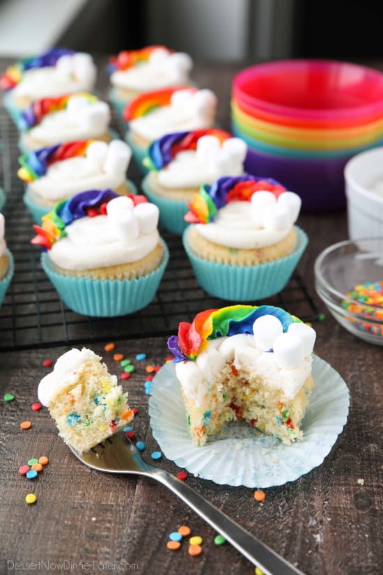 These Funfetti Rainbow Cupcakes are colorful inside and out! Homemade funfetti cupcakes are moist and full of sprinkles. Then topped with a colorful buttercream rainbow and mini marshmallow clouds. Super fun for birthday cupcakes or perfectly festive for St. Patrick's Day!