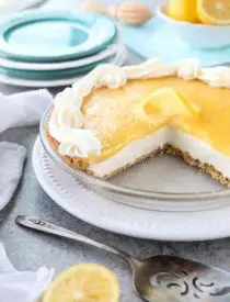 Lemon Cream Cheese Pie has layers of no-bake cheesecake and an easy microwave lemon curd inside of a vanilla wafer crust. It’s the perfect combination of sweet and tart. A great dessert for spring, Easter, or summer!