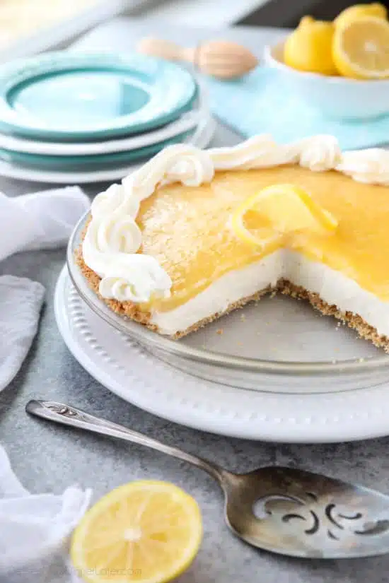 Lemon Cream Cheese Pie has layers of no-bake cheesecake and an easy microwave lemon curd inside of a vanilla wafer crust. It’s the perfect combination of sweet and tart. A great dessert for spring, Easter, or summer!