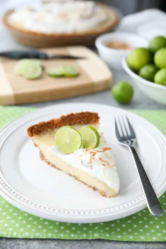 Coconut Key Lime Pie has coconut in the crust, cream of coconut in the key lime filling, and toasted coconut on top! A tropical dessert that's creamy, sweet, and tart.