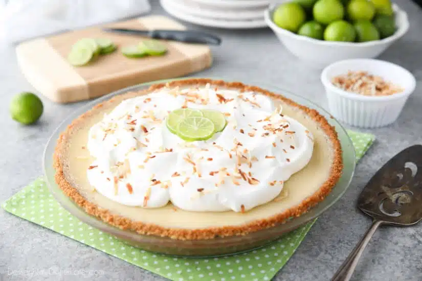 Coconut Key Lime Pie has coconut in the crust, cream of coconut in the key lime filling, and toasted coconut on top! A tropical dessert that's creamy, sweet, and tart.