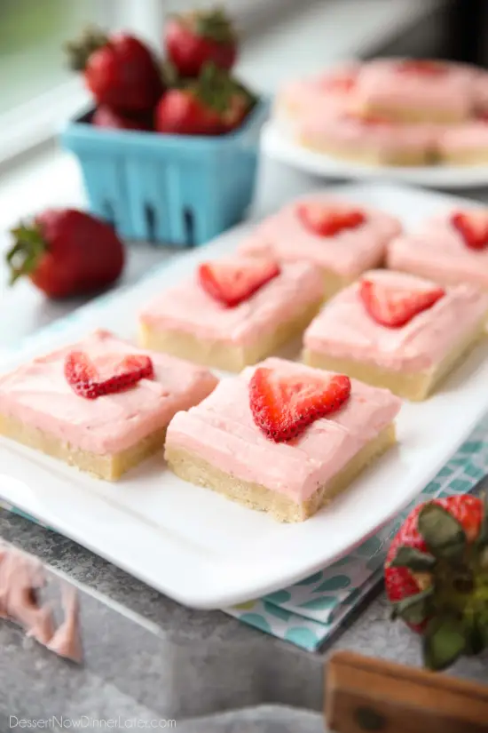 Strawberry Sugar Cookie Bars - soft, moist sugar cookie bars are topped with a natural strawberry frosting. Super easy to make and serves a crowd!