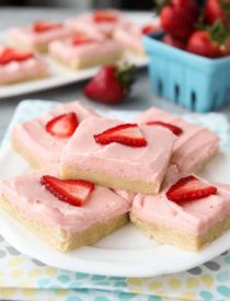 Strawberry Sugar Cookie Bars - soft, moist sugar cookie bars are topped with a natural strawberry frosting. Super easy to make and serves a crowd!