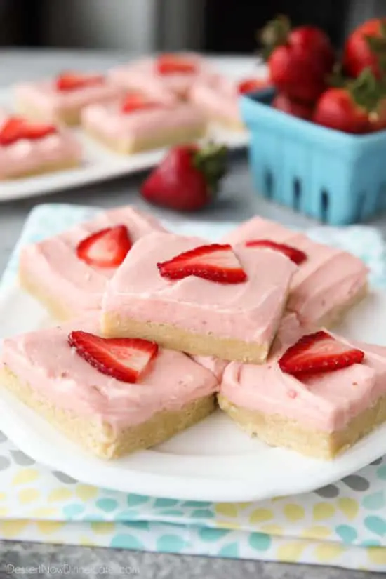 Strawberry Sugar Cookie Bars - soft, moist sugar cookie bars are topped with a natural strawberry frosting. Super easy to make and serves a crowd!