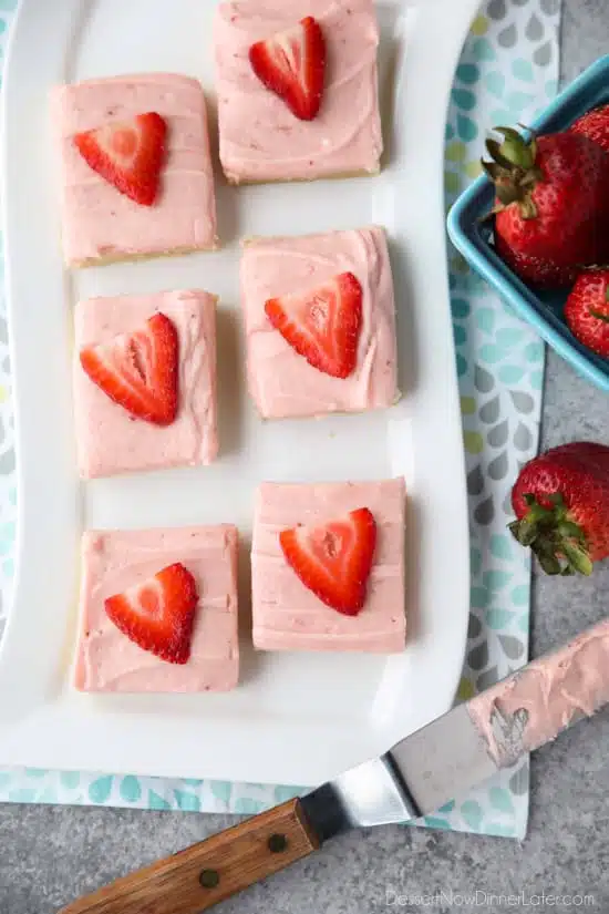 Strawberry Sugar Cookie Bars - soft, moist sugar cookie bars are topped with a natural strawberry frosting. Super easy to make and serves a crowd!