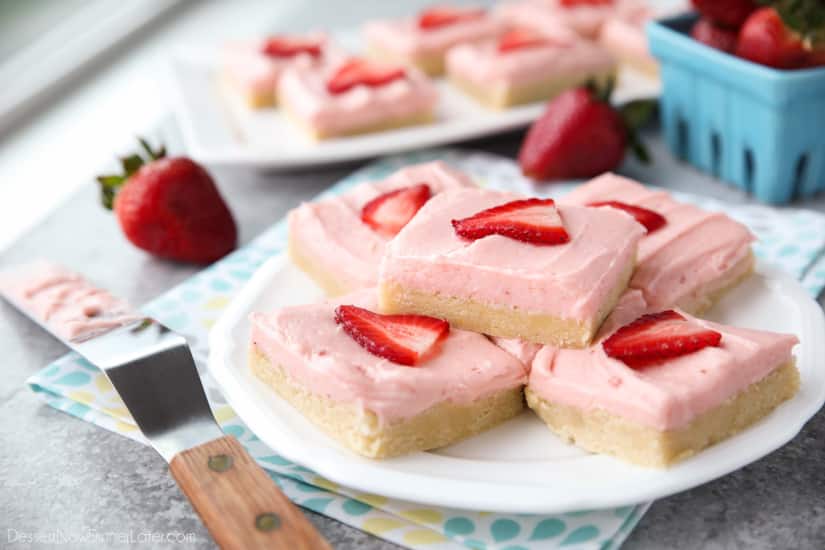 Strawberry Sugar Cookie Bars - soft, moist sugar cookie bars are topped with a natural strawberry frosting. Super easy to make and serves a crowd!