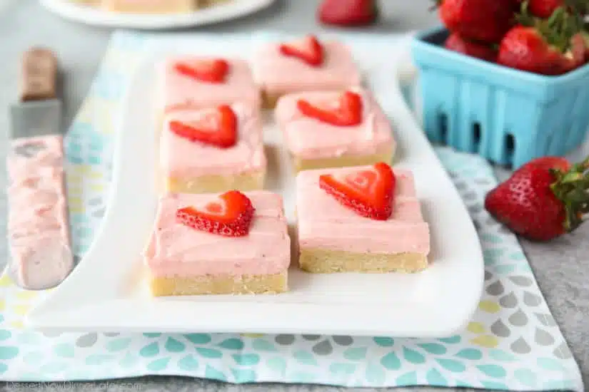 Strawberry Sugar Cookie Bars - soft, moist sugar cookie bars are topped with a natural strawberry frosting. Super easy to make and serves a crowd!