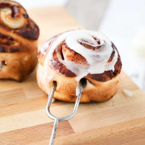 Campfire Cinnamon Rolls are cooked on a stick over a fire or grill. As easy as a can of biscuits, but with real yeast dough instead! The best cinnamon rolls you will ever have while camping!