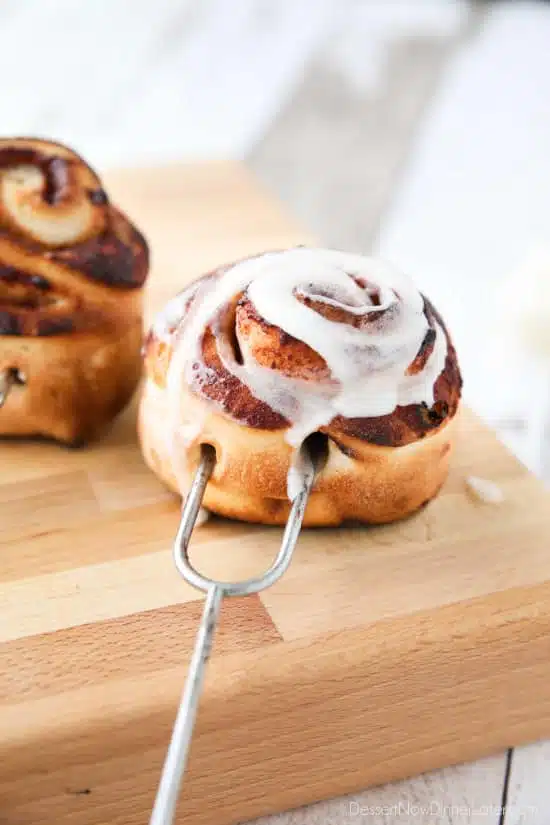 Campfire Cinnamon Rolls are cooked on a stick over a fire or grill. As easy as a can of biscuits, but with real yeast dough instead! The best cinnamon rolls you will ever have while camping!