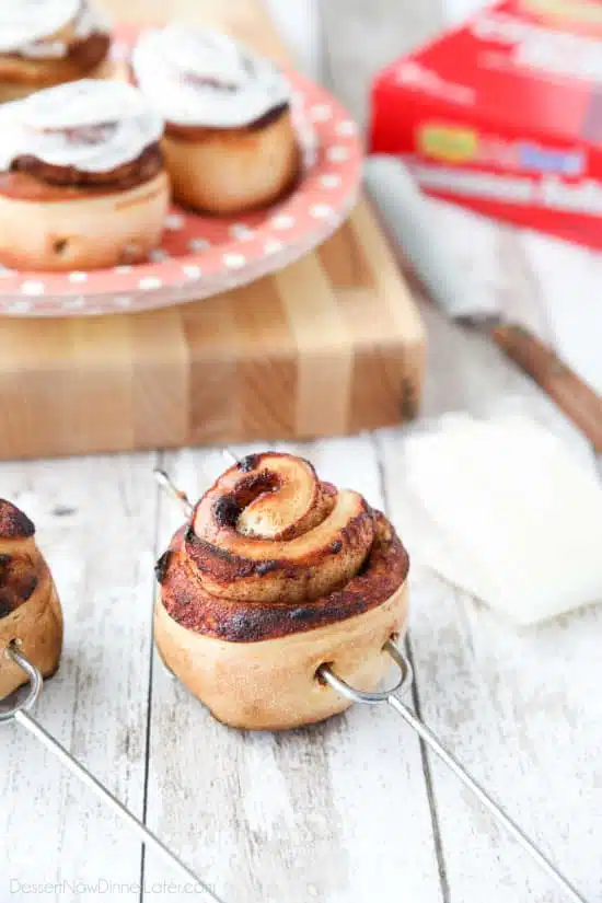 Campfire Cinnamon Rolls are cooked on a stick over a fire or grill. As easy as a can of biscuits, but with real yeast dough instead! The best cinnamon rolls you will ever have while camping!