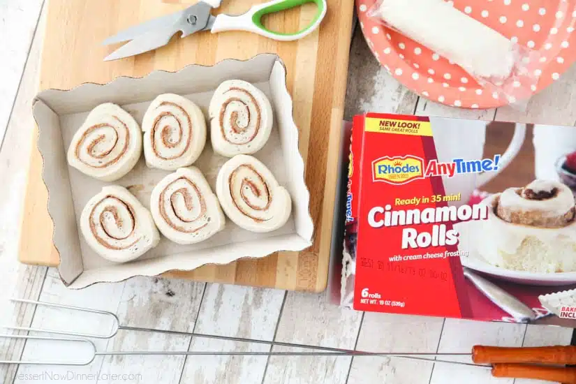 Campfire Cinnamon Rolls are cooked on a stick over a fire or grill. As easy as a can of biscuits, but with real yeast dough instead! The best cinnamon rolls you will ever have while camping!